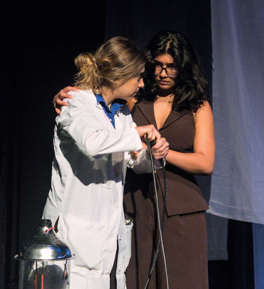 The Scientist and her assistant at the machine